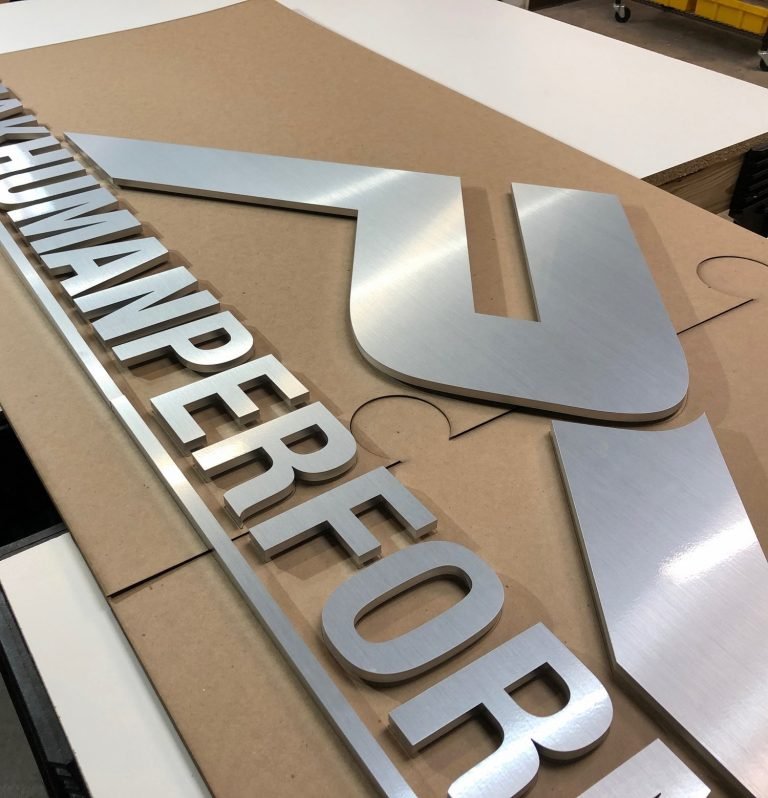 Laser cutting services WE LASERS Laser cut sign for Peak Human Performance. Brushed aluminum finish.