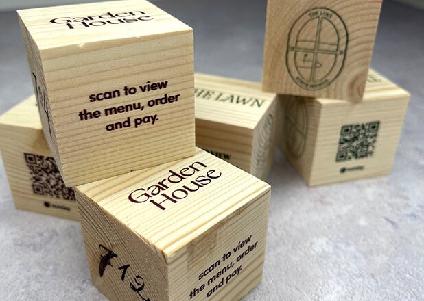 QR codes printed on wooden blocks